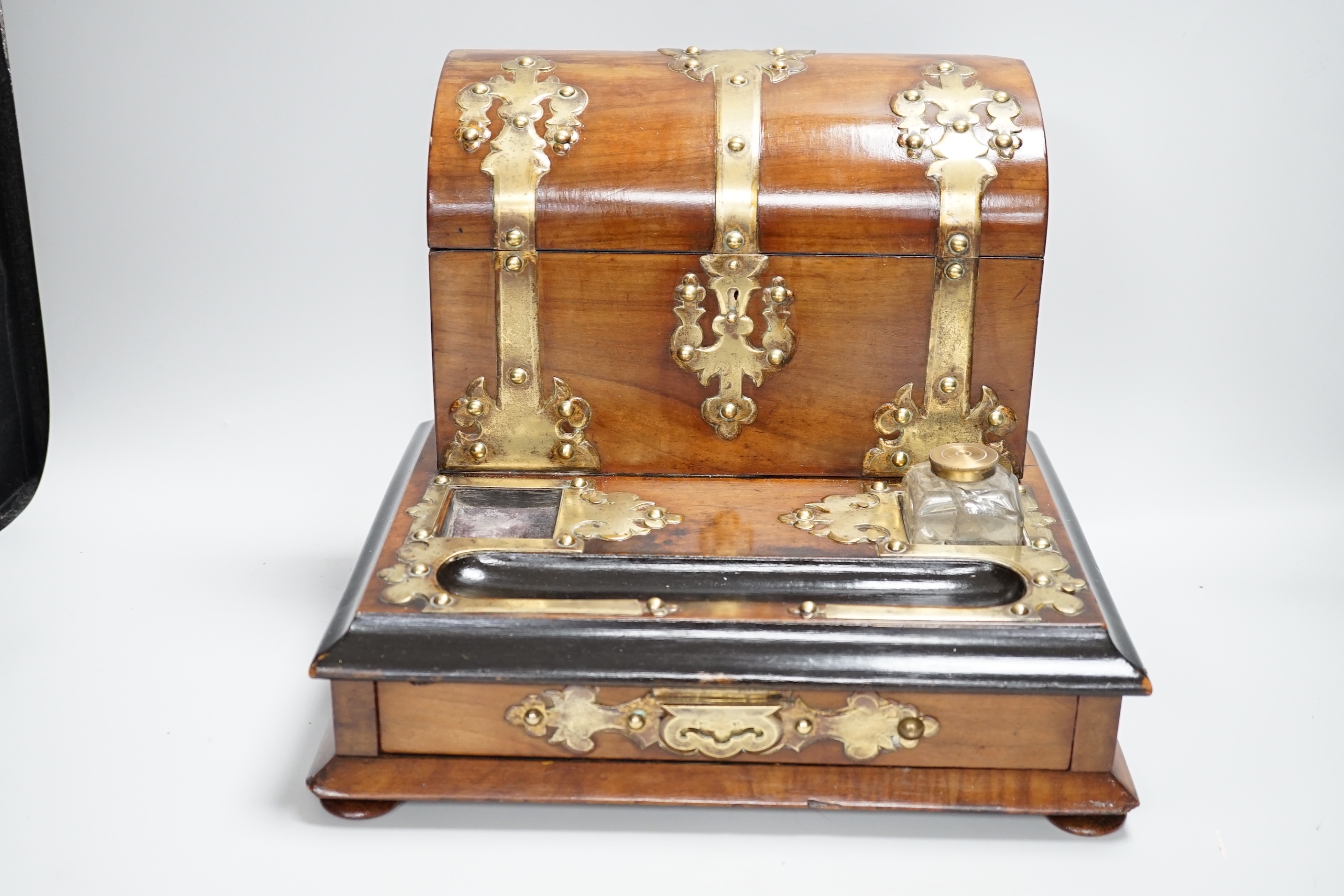 A Victorian walnut brass mounted dome topped stationery box and ink stand and an oval oak and a brass two handled tray, stationery box 25cm high